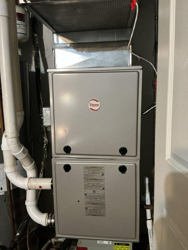 Performed scheduled heating maintenance on Payne furnace system installed in utility closet. Inspected unit components including ductwork, Prestige Air filter, condensate drain lines, and ventilation pipes. All connections and systems were found to be in normal operating condition with no signs of damage or deterioration.