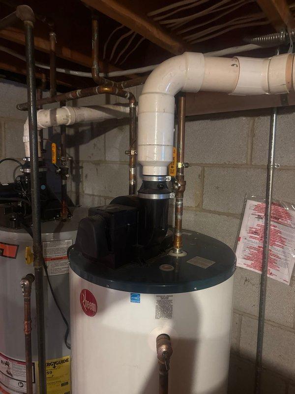 Responded to service call for TNP valve leak on a 2011 Bradford water heater with insufficient heating performance. Inspected dual-tank system in basement utility area, where the primary tank was struggling to maintain adequate water temperature. Replaced faulty temperature and pressure relief valve to resolve leakage issue and restore proper heating functionality.