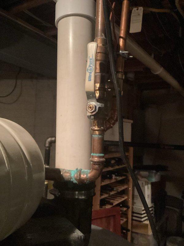 Conducted comprehensive inspection of residential plumbing system with focus on copper pipe network showing signs of corrosion at multiple joints. Documented significant turquoise discoloration on copper fittings connected to main PVC supply line and examined TurboTwin control valve for proper functionality. Identified potential issues with pipe insulation on hot water lines and verified structural integrity of mounting hardware supporting the installation.