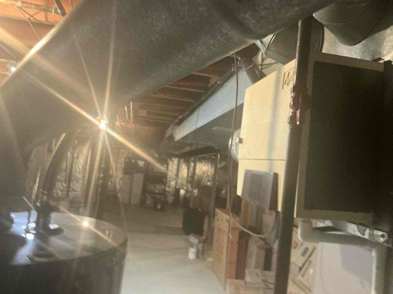 Conducted assessment for furnace replacement options including humidifier integration. Evaluated existing installation in basement utility area, noting current ductwork configuration and system placement constraints. Presented multiple system configurations with humidifier options for complete HVAC system upgrade.