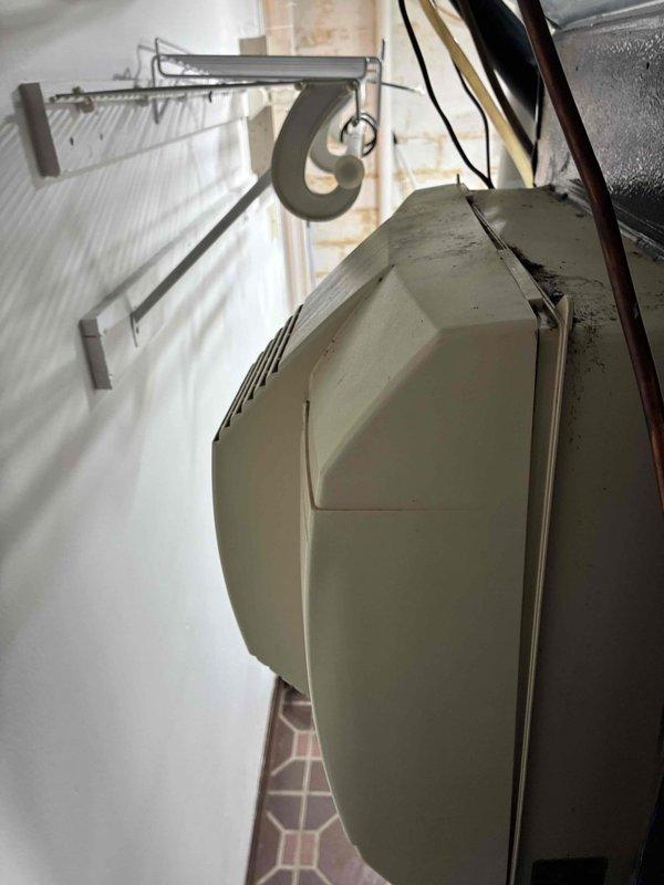 Diagnosed and assessed 9-month-old water heater exhibiting significant leakage from top and bottom connections with visible rust formation. Inspection of copper supply lines revealed aging connections with mineral deposits and surface corrosion contributing to the leak severity. Documented deteriorating installation with photographic evidence for warranty claim consideration.