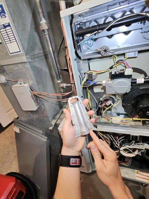 Performed routine heating system maintenance on furnace unit. Inspected and cleaned flame sensor/igniter components. Conducted carbon monoxide testing with Bacharach analyzer which confirmed zero CO readings across all measurement points, verifying proper combustion and safe system operation.