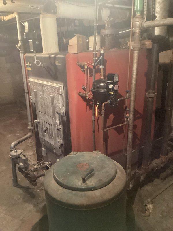 Performed contracted maintenance service on water boiler system, including inspection of expansion tank, flow control valves, and circulator pump. Verified proper operation of all components in the heating system, with particular attention to the red boiler unit and associated piping network. All connections, valves, and fittings were examined and confirmed to be in normal working condition with no leaks or damage detected.