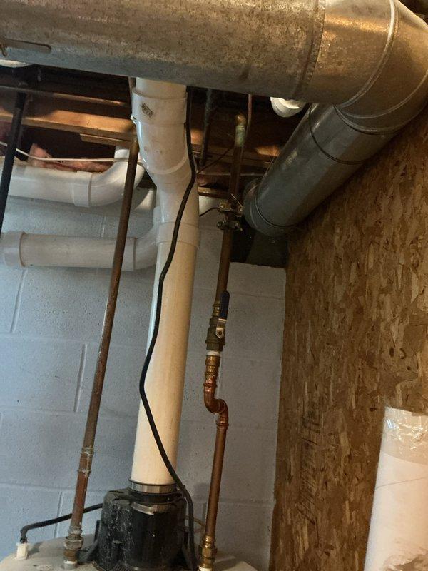 Conducted comprehensive electrical panel inspection in basement utility area. Panel inspection revealed properly connected circuit breakers with appropriate wiring configuration, though panel showed signs of crowded wire management. Adjacent plumbing and HVAC systems were noted with no apparent electrical hazards or code violations observed.