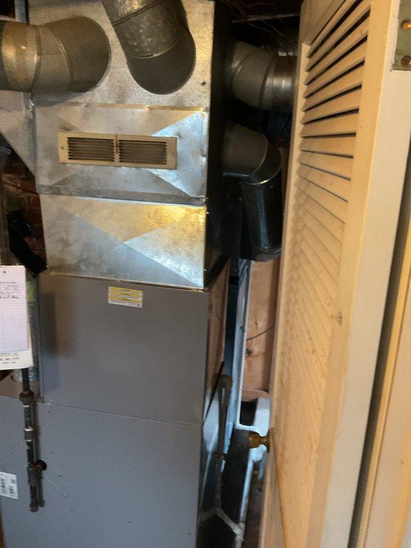 Performed routine maintenance on residential heating system, including inspection of furnace, ductwork connections, and ventilation components. System appears to be functioning properly with no operational issues noted; all connections secure and properly installed.