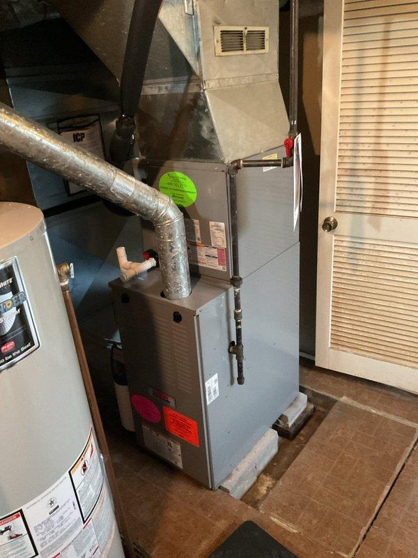 Performed routine maintenance on residential heating system, including inspection of furnace, ductwork connections, and ventilation components. System appears to be functioning properly with no operational issues noted; all connections secure and properly installed.