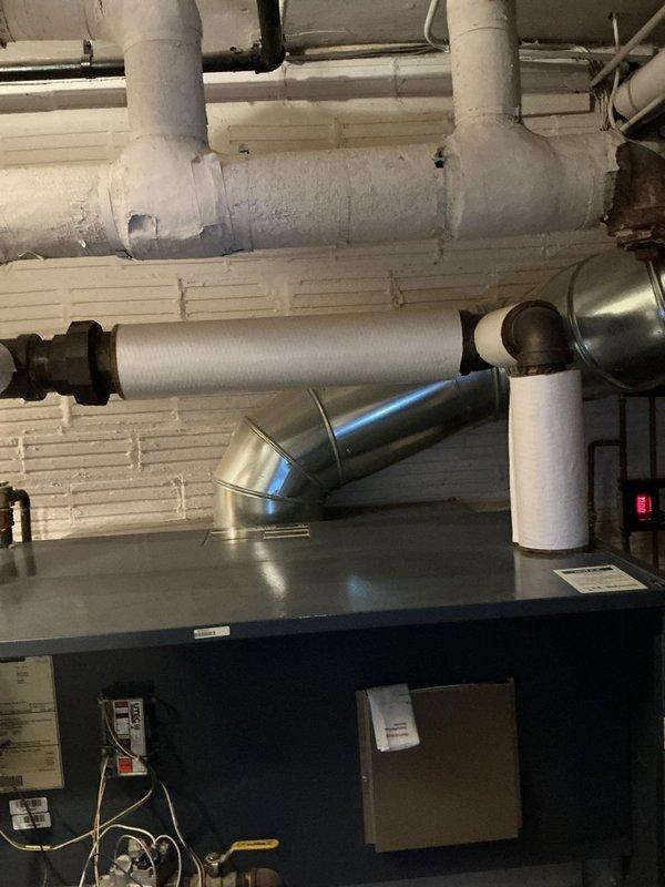 Responded to emergency service call for a severely leaking boiler. Upon inspection, identified water level issues as indicated by the gauge glass, which was below the safe minimum water line (5/8" above lowest visible part). Repaired leaking connections at pipe joints and restored proper water level in the system to manufacturer specifications.