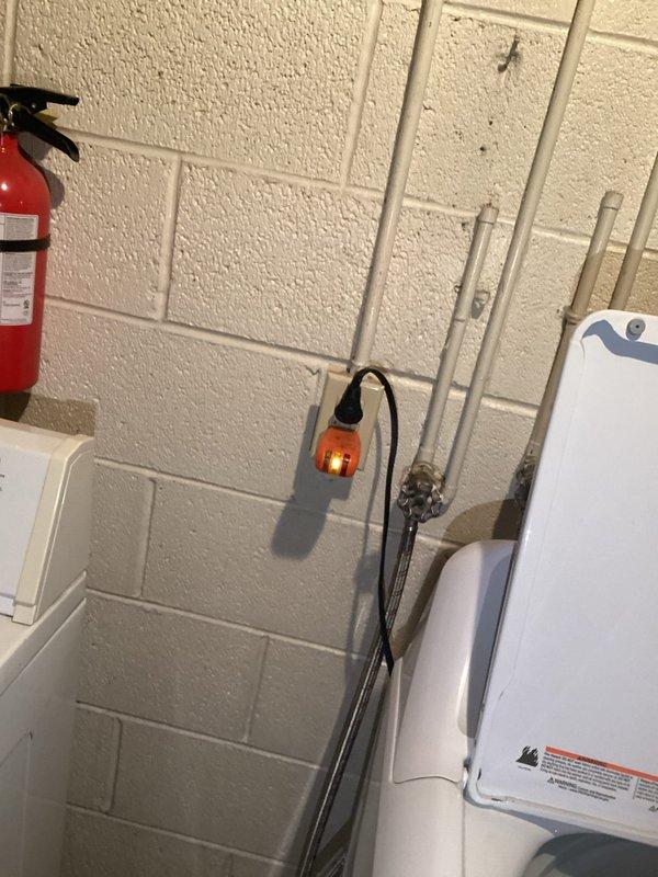 Completed circuit installation for washing machine in utility area of basement. Routed new dedicated circuit through exposed ceiling joists and connected to existing electrical panel. Tested circuit functionality to ensure proper voltage and grounding for appliance operation.