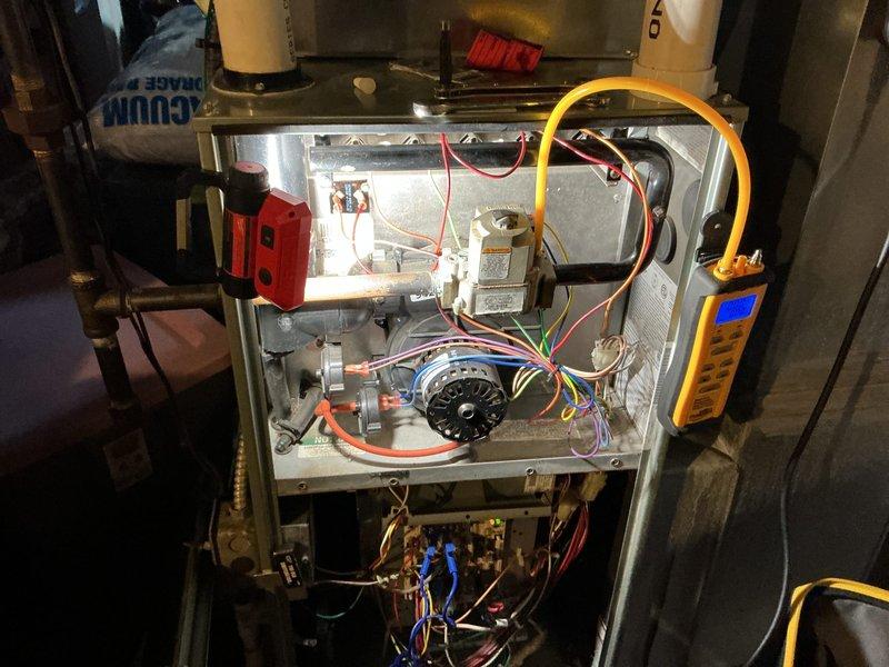 Performed follow-up heating maintenance on aging HVAC system (10+ years). Inspected blower wheel assembly which showed moderate dust accumulation and normal wear. Conducted electrical diagnostic testing using multimeter on control components and verified proper operation of gas valve mechanism.