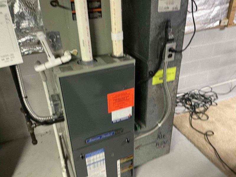 Performed comprehensive assessment of existing HVAC system in basement for potential replacement options. Evaluated current installation which includes furnace with PVC exhaust ventilation, associated ductwork, and control interfaces. Documented condition of equipment, noting proper insulation and connection requirements for replacement recommendations.