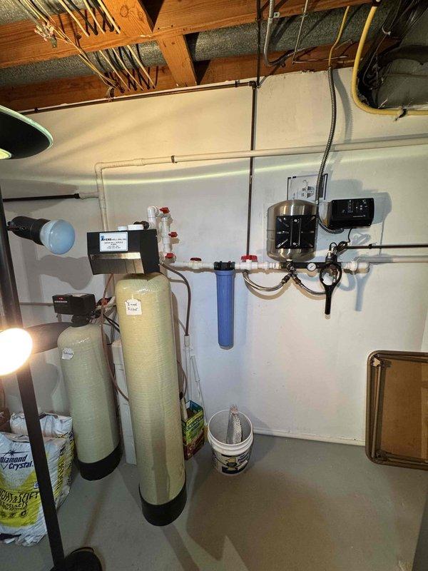Performed scheduled heating maintenance service on residential furnace system. Inspected and replaced air filter which showed significant dust accumulation. Examined water filtration system including pressure tanks, valves, and related components - all functioning properly.