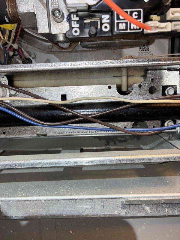 Completed scheduled heating maintenance service on system. Performed combustion analysis using UEI EM152 manometer with reading of 38.1 pressure units. Inspected control switch assembly and internal wiring connections, confirming proper operation of all components.