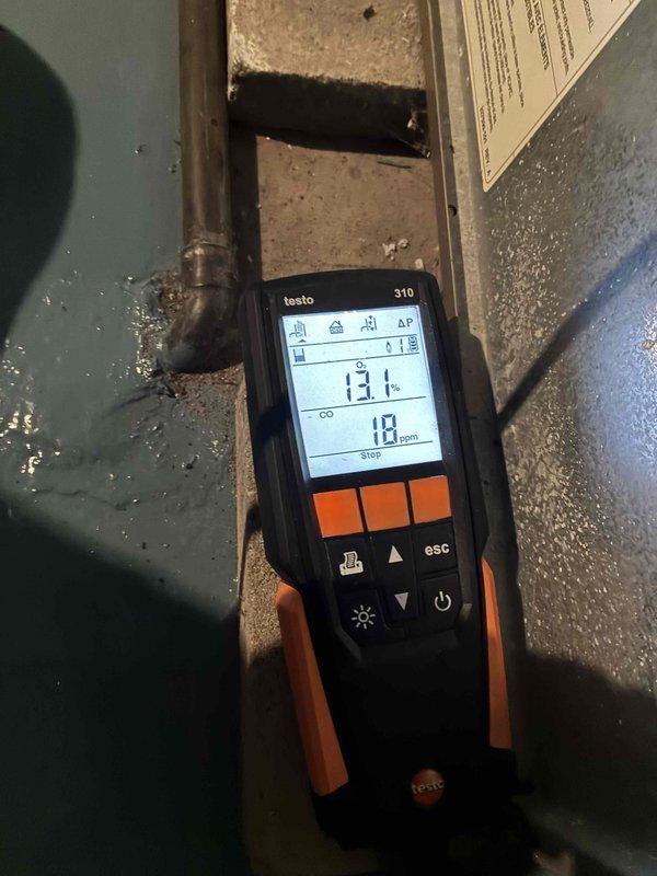 Performed routine heating maintenance on an aging system (10+ years old). Conducted combustion analysis with Testo 310 analyzer, measuring flue temperature at 131° with carbon monoxide levels at 18 ppm, which falls within acceptable parameters. Visual inspection of heat exchanger revealed normal condition with no signs of deterioration or cracks in the fins.