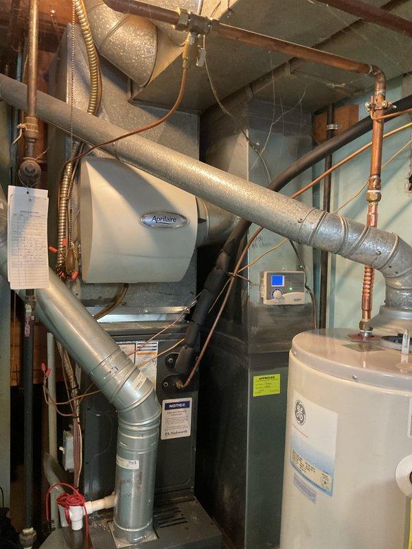Performed monthly heating maintenance service on 8-year-old furnace system. Inspected blower motor assembly, electrical connections, gas burner assembly, and associated ductwork, finding all components in normal working condition. Also examined the attached Aprilaire humidifier unit and confirmed proper integration with the HVAC system.