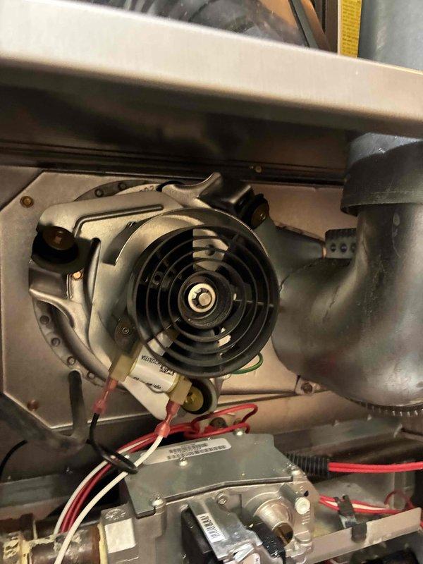 Performed heating maintenance on aging Carrier system (10+ years old). Serviced blower motor assembly and inspected electrical connections. Replaced air filter with new pleated media to restore proper airflow and system efficiency.