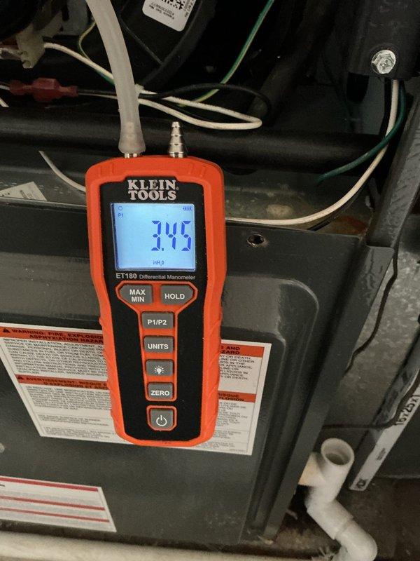 Performed scheduled heating maintenance on system. Conducted differential pressure testing using manometer, with readings of 3.60 and 3.45 inH₂O recorded, confirming proper gas pressure within manufacturer specifications. System is operating normally with no issues detected.