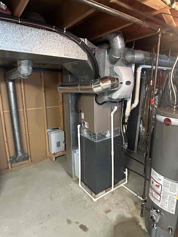 Successfully completed installation of new furnace with humidifier in basement utility room. Unit was properly connected to existing ductwork with PVC venting system and all electrical components. System was tested and verified to be functioning at 96% efficiency.