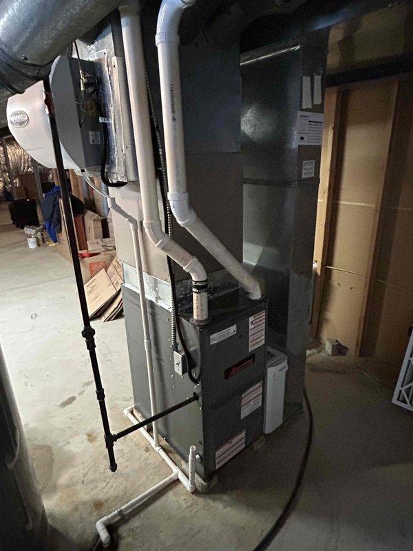 Successfully completed installation of new furnace with humidifier in basement utility room. Unit was properly connected to existing ductwork with PVC venting system and all electrical components. System was tested and verified to be functioning at 96% efficiency.
