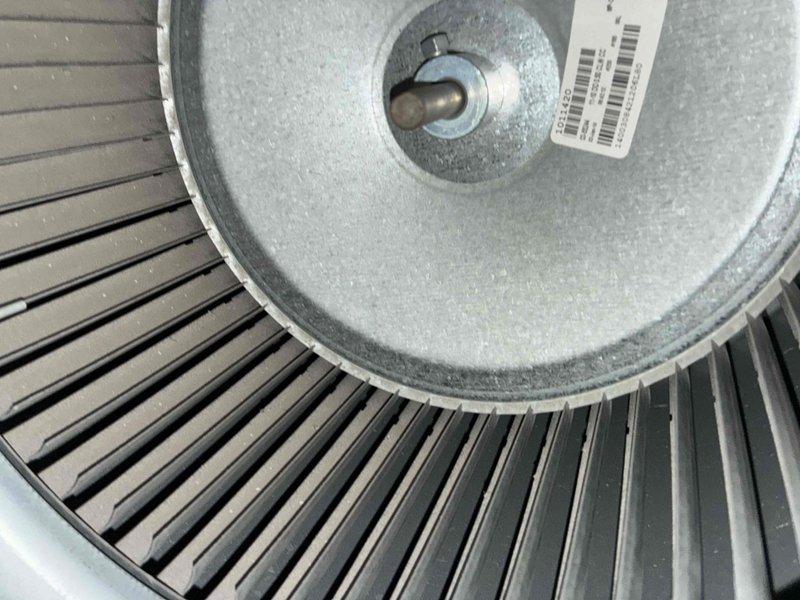 Performed routine heating maintenance service including electrical testing with clamp meter showing normal voltage readings (36.24V) and inspection of blower wheel assembly. Visual examination confirmed proper condition of fan components with no signs of damage or excessive wear.