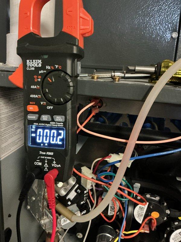 Responded to no heat complaint where furnace was cycling on and off. Performed electrical diagnostic testing using clamp meter on control panel, checking voltage and current readings. Inspected furnace system including PVC venting configuration and connection points for proper operation.