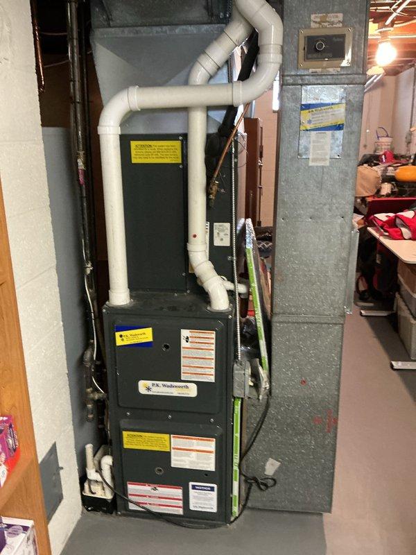 Responded to no heat complaint where furnace was cycling on and off. Performed electrical diagnostic testing using clamp meter on control panel, checking voltage and current readings. Inspected furnace system including PVC venting configuration and connection points for proper operation.