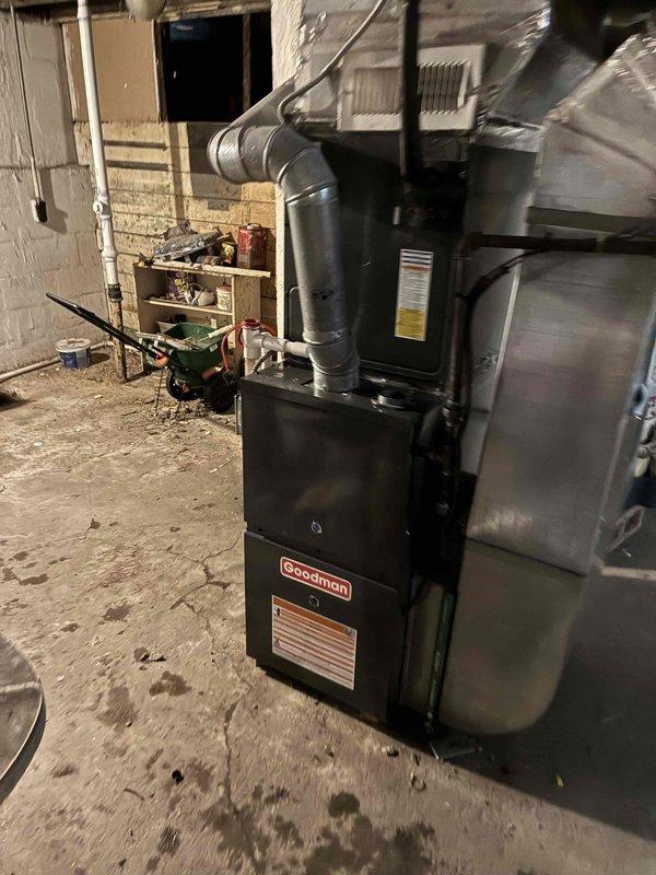 Successfully installed new Goodman furnace in basement utility room, including connection of all required ductwork, electrical components, and gas line. Unit was properly mounted against concrete wall with appropriate clearances and all connections were tested to ensure proper functionality.
