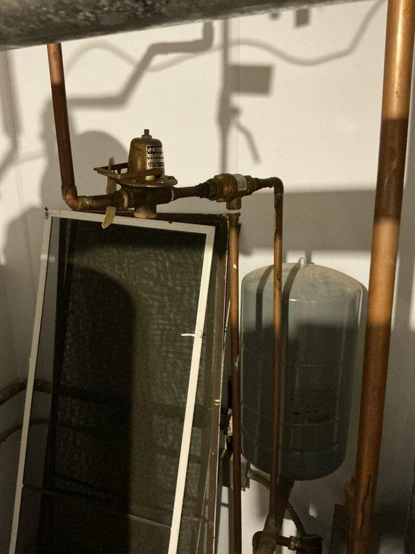 Performed diagnostic assessment on non-functioning boiler system. Documented existing plumbing infrastructure showing aged copper pipes with significant oxidation and examined pressure regulation components. Presented replacement options to customer who indicated they are evaluating multiple estimates for resolving the no-heat situation.