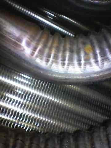 Performed scheduled heating maintenance service on furnace system. Inspected and tested electrical connections, ensuring proper wire terminal connections were secure. Examined heat exchanger coils and fins for cleanliness and proper operation, noting normal oxidation on copper components.