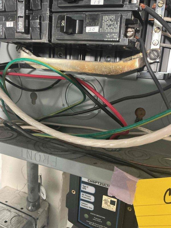 Completed heating system maintenance inspection following customer concern about ice buildup on exhaust during recent cold weather. Inspected electrical panel and discovered moderate corrosion on copper bus bar connections. Documentation included photographs of the electrical panel showing circuit breakers, wiring condition, and the affected components for reference.