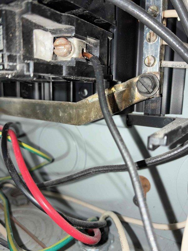 Completed heating system maintenance inspection following customer concern about ice buildup on exhaust during recent cold weather. Inspected electrical panel and discovered moderate corrosion on copper bus bar connections. Documentation included photographs of the electrical panel showing circuit breakers, wiring condition, and the affected components for reference.
