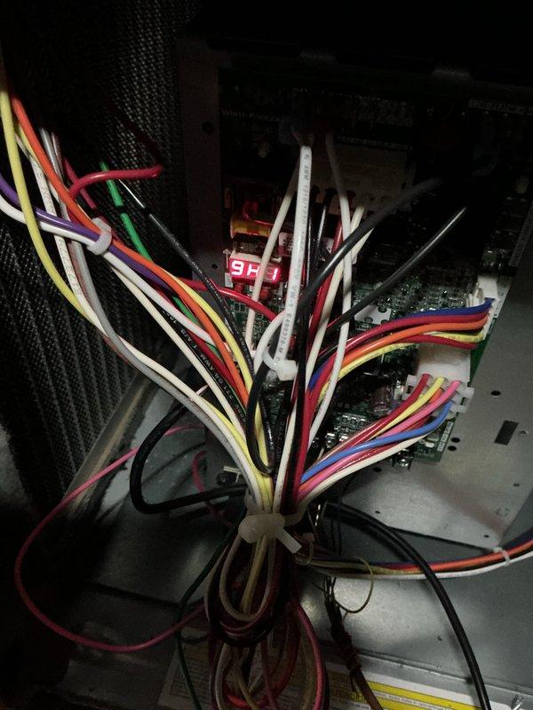 Performed routine heating maintenance inspection. Inspected Aprilaire humidistat mounted on concrete wall, checking wiring connections and functionality. Examined internal control board and wiring harness of heating system, verifying proper connections of multi-colored control wires to ensure proper system operation.