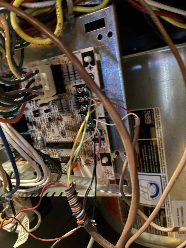 Completed dual system heating maintenance service. Inspected circuit board and electrical connections in control system, noting proper wire connections and component functionality. Examined blower wheel assembly which showed normal dust accumulation but remains in serviceable condition with no immediate concerns.