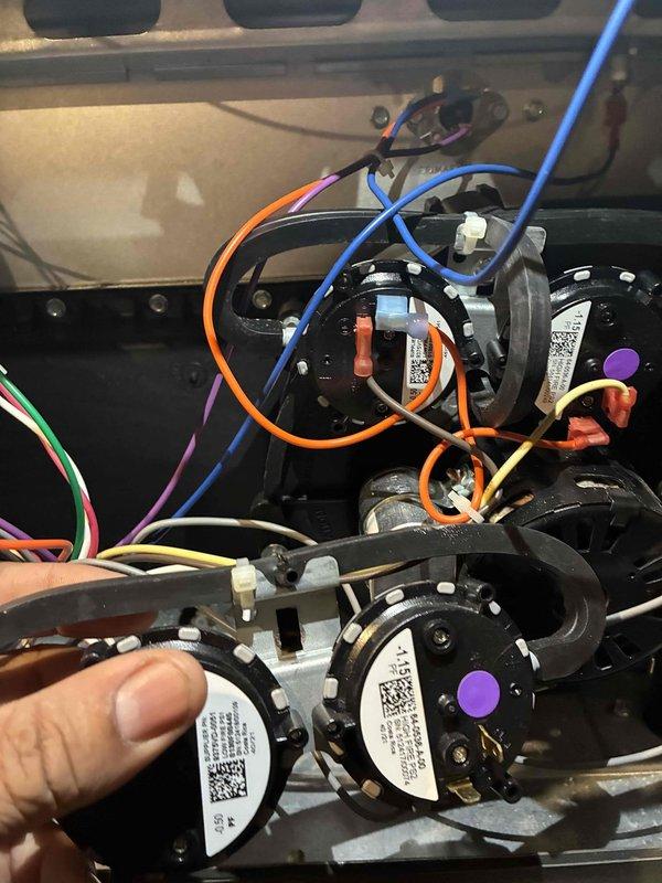 Performed warranty service to replace malfunctioning pressure switches under parts and labor warranty. Accessed internal electrical components of the HVAC system, disconnected the original pressure switches from the wiring harness, and installed new replacement switches, ensuring proper connection of all color-coded wiring to appropriate terminals.