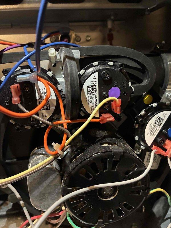 Performed warranty service to replace malfunctioning pressure switches under parts and labor warranty. Accessed internal electrical components of the HVAC system, disconnected the original pressure switches from the wiring harness, and installed new replacement switches, ensuring proper connection of all color-coded wiring to appropriate terminals.