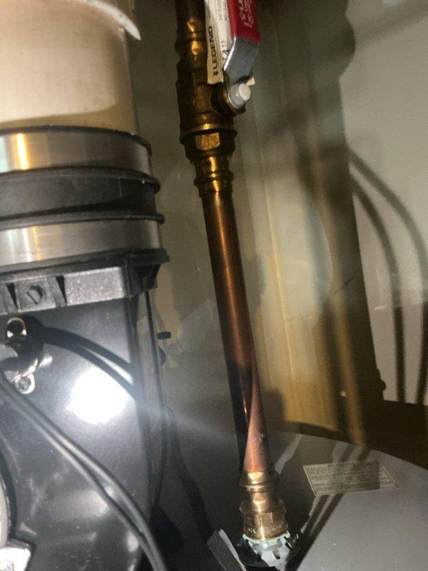 Performed scheduled heating maintenance service on two HVAC systems. Inspected copper piping, valves and pump assembly in utility area. Examined internal components including blower assembly with blue LED indicators, confirming proper operation of both heating units.