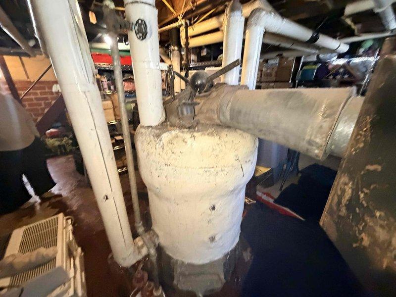 Responded to service call for APCO boiler leaking water that customer had shut down. Upon inspection of the aging unit, found water leakage around base of system. Identified failed gasket at circulation pump connection as source of leak, replaced gasket and checked all associated valves and pressure readings. System restored to proper operation with no further leaks detected.
