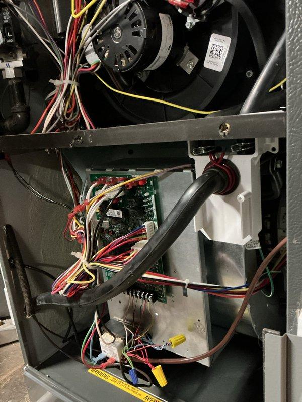 Responded to service call for thermostat malfunction on recently installed system (2/10). Inspected furnace interior components including blower motor, circuit board, and wiring connections - all found to be in normal working condition with no visible damage. Verified proper installation of ductwork and ventilation in utility room; system is now functioning correctly.