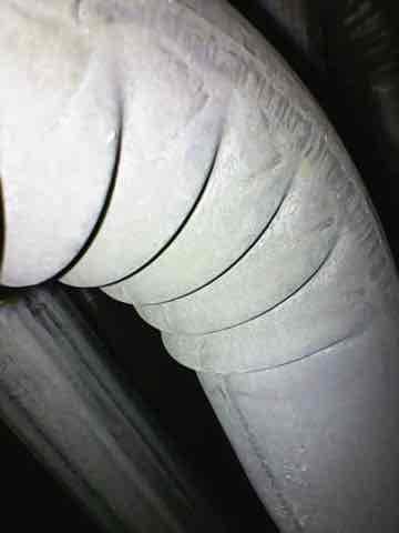 Performed routine heating maintenance on an aging system (10+ years old). Inspected insulated ductwork for integrity and proper sealing. Accessed interior components to check connections, wiring, and blower assembly, with particular attention to the flexible hose connections and electrical wiring integrity.