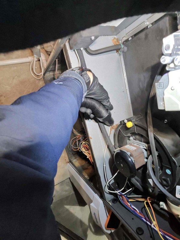 Performed routine heating maintenance on an aging system (10+ years old). Inspected insulated ductwork for integrity and proper sealing. Accessed interior components to check connections, wiring, and blower assembly, with particular attention to the flexible hose connections and electrical wiring integrity.