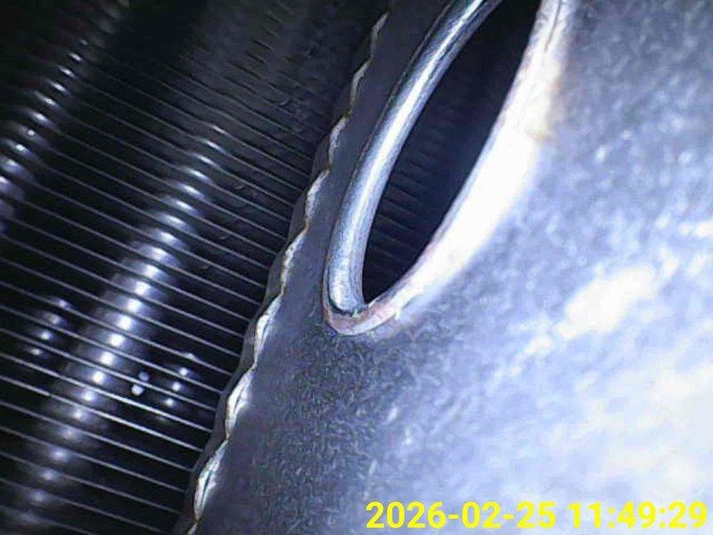 Performed comprehensive heating tune-up on HVAC system, including inspection of heat exchanger fins and ventilation components. Visual examination revealed proper condition of metal components with no visible damage or blockages in the circular duct opening. All system elements were verified to be functioning within normal parameters.