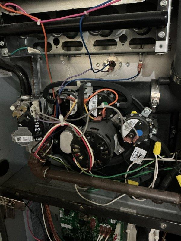 Performed scheduled heating maintenance service on residential furnace system. Inspected control boards, electrical connections, and wiring harnesses, confirming all components were properly secured and functioning normally. Verified blower motor assembly operation with no issues detected in the electronic control systems.