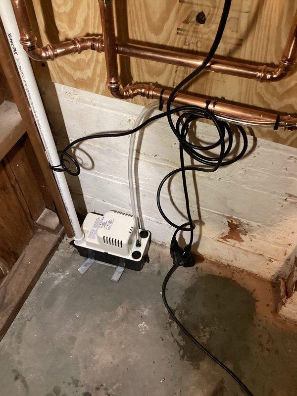 Successfully installed a Rinnai tankless water heater with complete copper piping network, including necessary valves and connections. Mounted unit securely to wooden wall structure and installed proper PVC ventilation system and condensate pump. All connections were tested and system is functioning as designed.