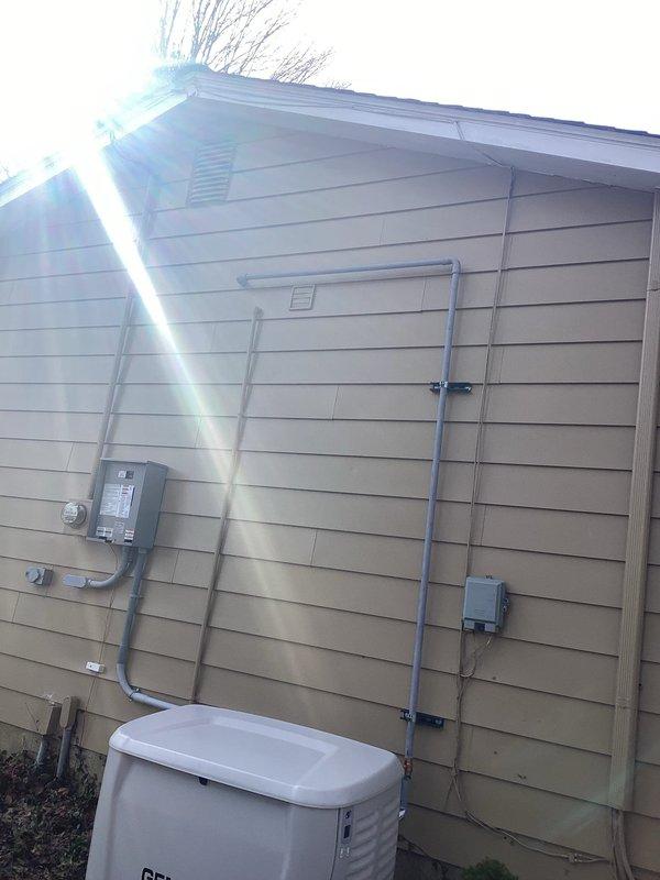 Successfully completed installation of a 22kW Generac generator with standard warranty. Work included mounting the unit to exterior wall, running electrical conduit connections to the home's meter box, and installing the required PVC vent piping through the exterior siding with proper sealing. All connections were properly secured and the system was tested for correct operation.