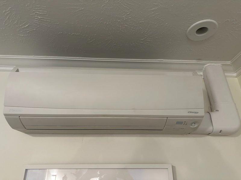 Successfully replaced a faulty condensate pump on a Daikin FTXS09WVJU9 mini split system under manufacturer's parts warranty. The wall-mounted indoor unit is now functioning properly with the new pump installed and the condensate drain line verified for correct operation.