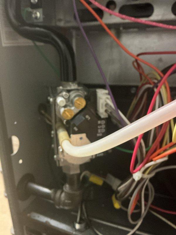 Responded to no-heat call on one-year-old furnace system. Inspected gas valve assembly and associated control wiring connections. Replaced dirty pleated air filter with new one to restore proper airflow and system operation.