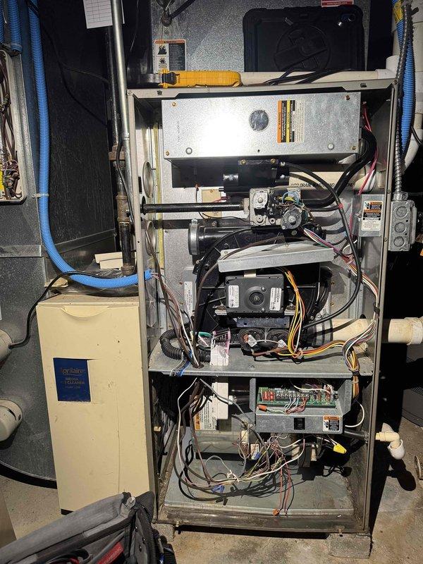 Performed routine heating maintenance on 10+ year old furnace system. Identified significant dust accumulation and reddish-brown staining on filter components requiring replacement. Service revealed electrical and plumbing issues that were documented but not addressed during this maintenance visit.