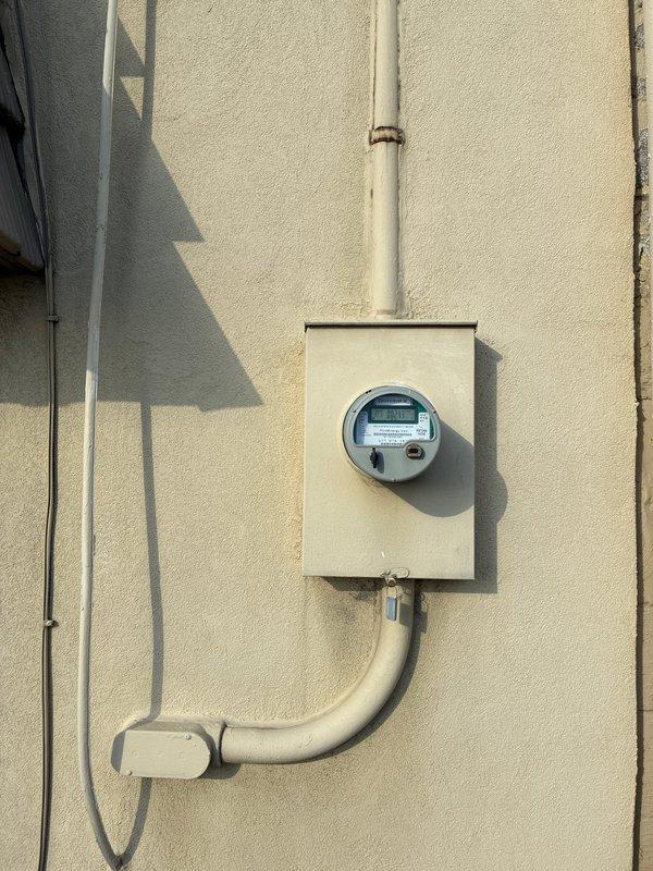 Conducted site assessment for garage heater installation in single-car commercial garage. Inspected existing electrical service panel and meter for compatibility with proposed heating system. Evaluated workspace conditions including ceiling clearance, electrical routing options, and potential mounting locations for unit installation.