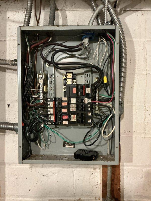 Performed inspection of Federal Pacific electrical panel and assessed installation requirements for new dedicated circuit to support tankless water heater. Documented existing service entrance configuration and current panel condition, noting multiple circuit breakers and wiring layout. Provided quote for complete panel replacement and new outlet installation as requested.