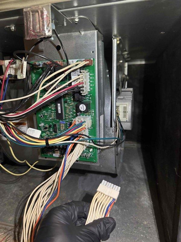 Responded to no-heat call and diagnosed malfunctioning furnace blower motor. Inspected control board connections and found loose wiring harness at the circuit board terminals. Reconnected the multi-pin connector to restore proper electrical continuity, verified system operation, and confirmed heat was restored to residence.