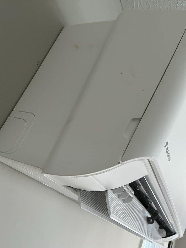 Responded to warranty call regarding Daikin mini-split system with electrical compartment issue. Upon inspection, found bulging wires preventing proper closure of the access panel on the indoor unit. Adjusted wire routing and secured connections at terminal block to allow proper panel closure and ensure system functionality.